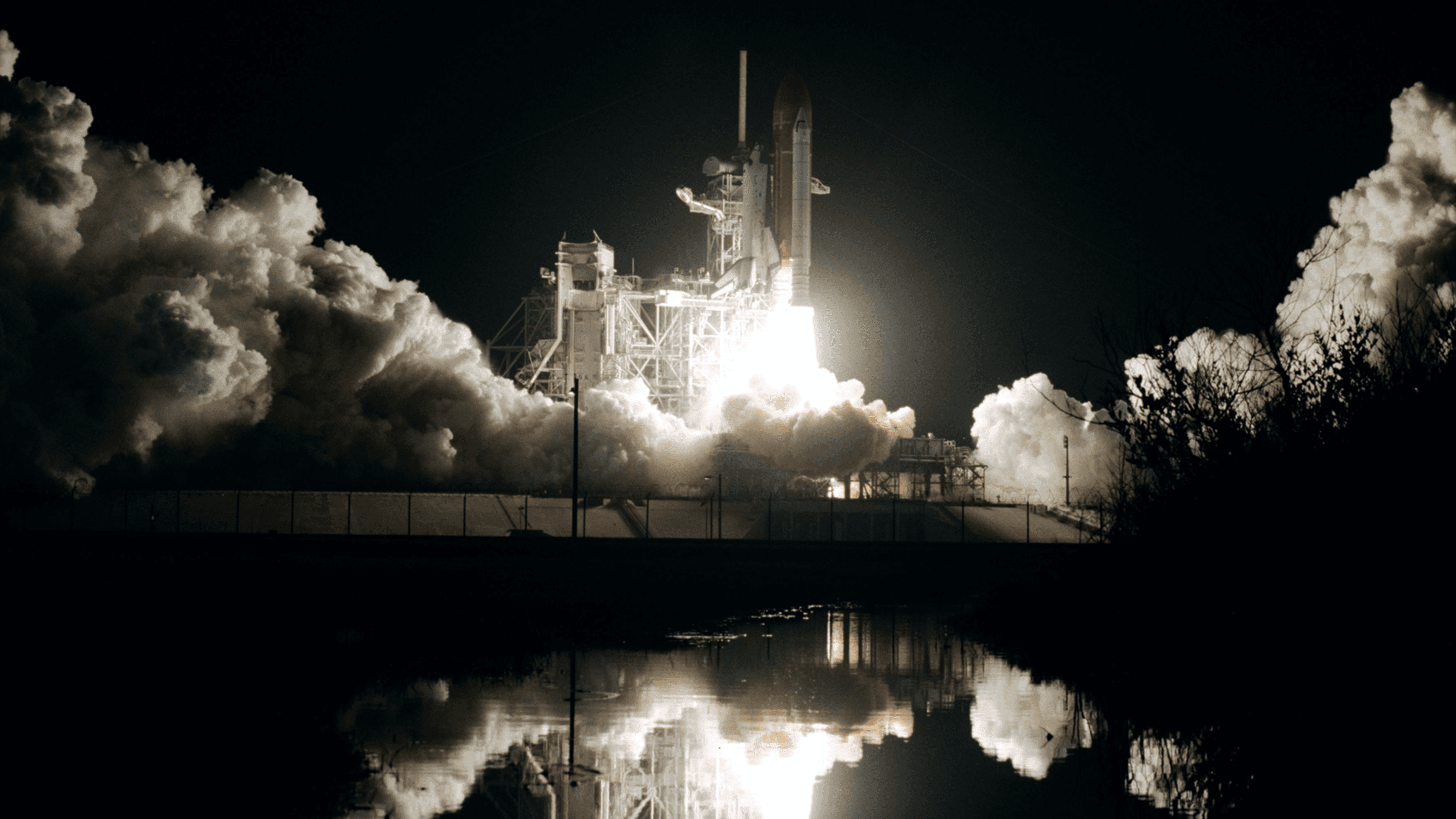 Space rocket flies into the air by night