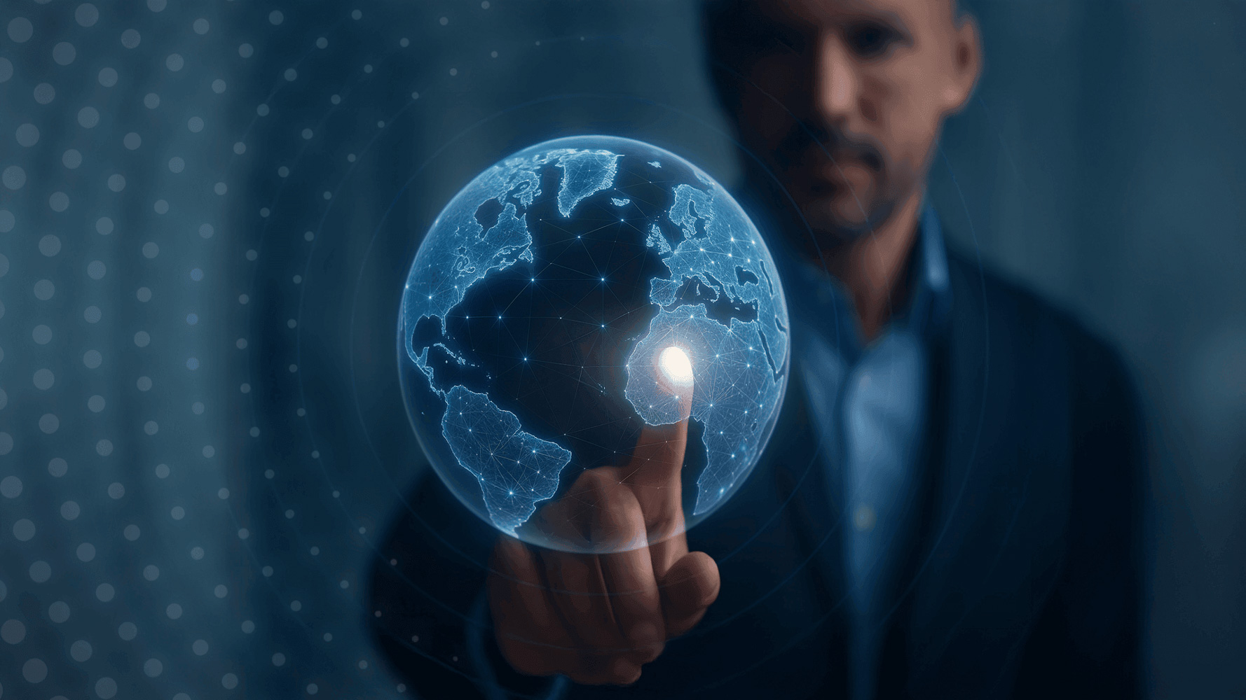 Businessman touching a glowing digital globe hologram representing global connectivity and innovation – HZ Group consulting digital strategy.