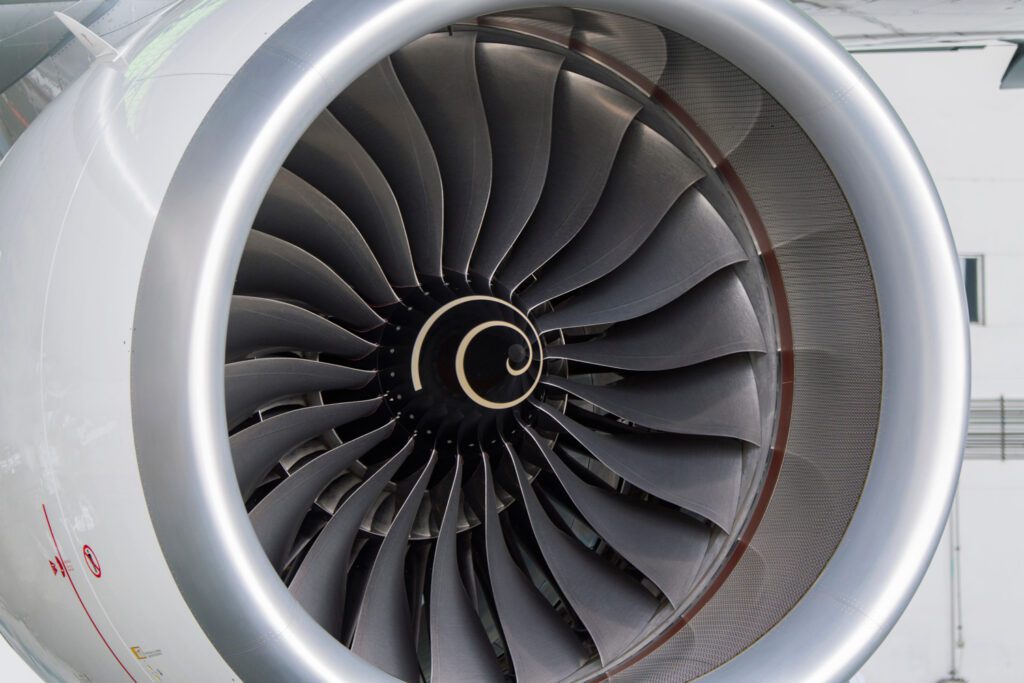 Close-up of a jet engine turbine with blades, representing aerospace engineering and precision manufacturing, highlighting the importance of due diligence and technical expertise in consulting.