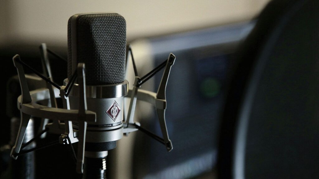 Professional studio microphone with shock mount set up for podcast recording, symbolizing high-quality audio production and engaging thought leadership discussions in consulting.