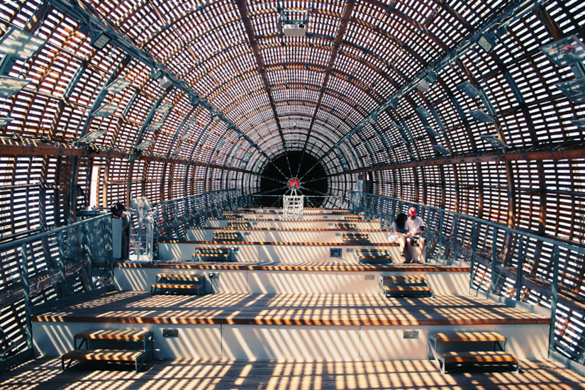 Long pedestrian tunnel with wooden slatted roof and benches – HZ Group consulting on modern infrastructure design