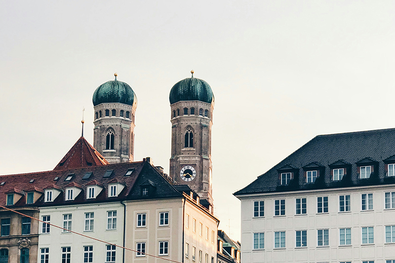 View of Munich's Frauenkirche twin towers and surrounding architecture, capturing the city context for H&Z digital consulting projects.
