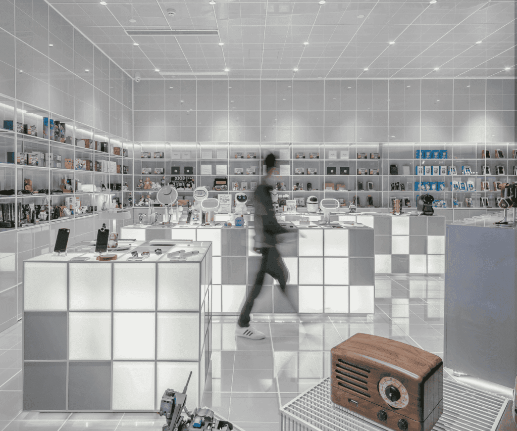 Contrast of modern technology and vintage design in an illuminated electronics showroom, featuring a blurred shopper and an antique wooden radio, highlighting innovation and transformation in a consulting narrative.