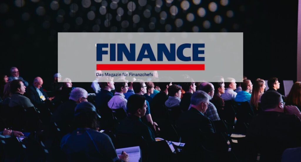 FINANCE magazine logo overlaid on a dimly lit conference audience for finance executives | H&Z