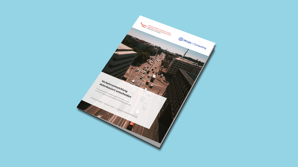 Print mock-up of the traffic development practice dossier on a light blue background | H&Z